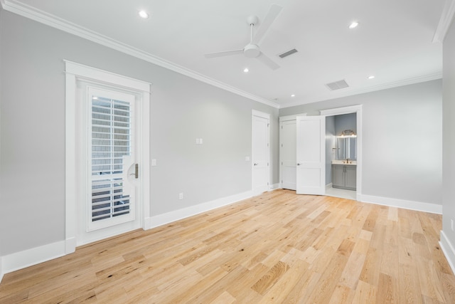 unfurnished room featuring ornamental molding, light wood-type flooring, baseboards, and a ceiling fan