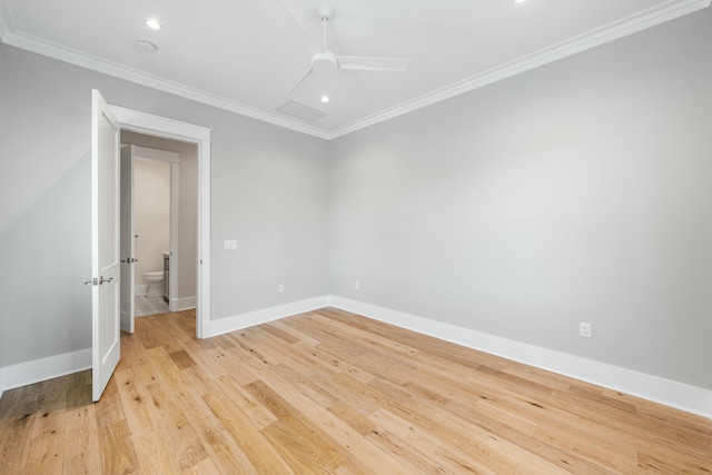 spare room with crown molding, ceiling fan, and light hardwood / wood-style floors