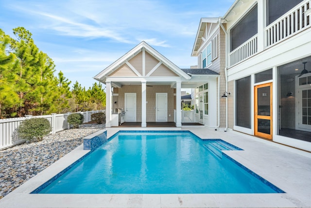 view of pool featuring a patio and ceiling fan