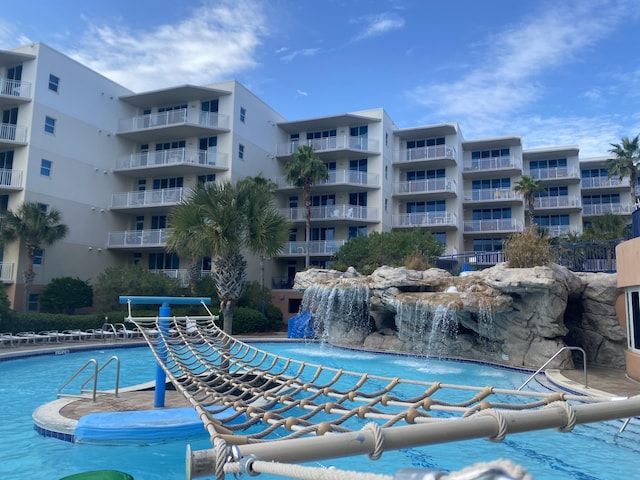 view of pool with pool water feature