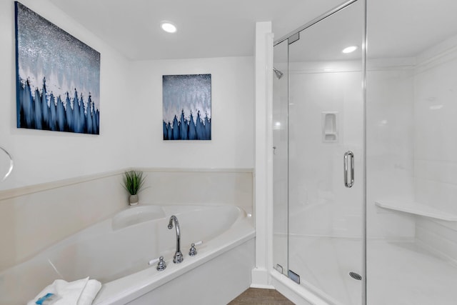 bathroom with shower with separate bathtub