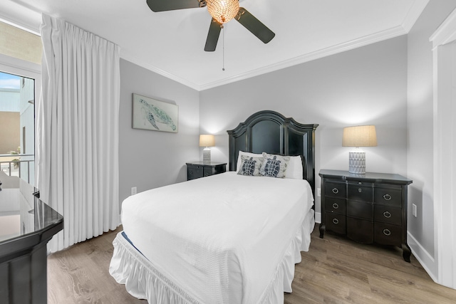 bedroom with ornamental molding, ceiling fan, and light hardwood / wood-style floors