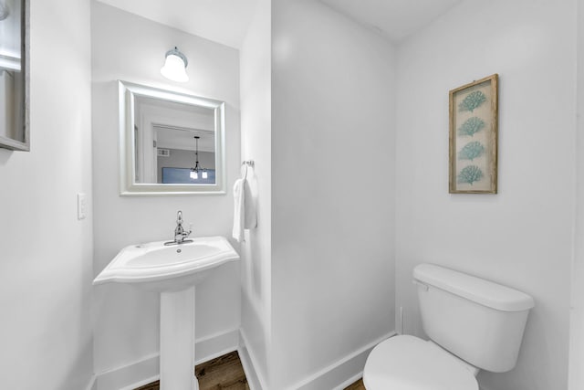 bathroom with toilet and sink