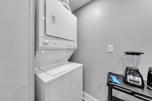 laundry room featuring stacked washer / dryer