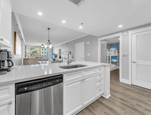 kitchen with sink, white cabinetry, ornamental molding, light hardwood / wood-style floors, and stainless steel dishwasher