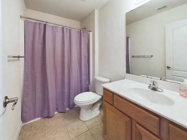 bathroom with visible vents, toilet, a shower with curtain, tile patterned flooring, and vanity