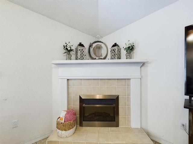 room details featuring a tile fireplace