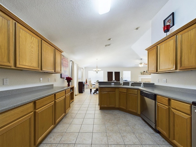 kitchen featuring stainless steel dishwasher, light tile patterned flooring, and brown cabinets