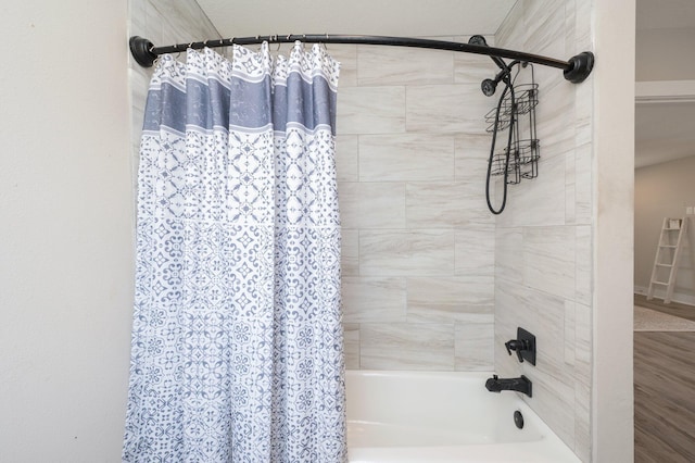 bathroom featuring shower / bath combo with shower curtain