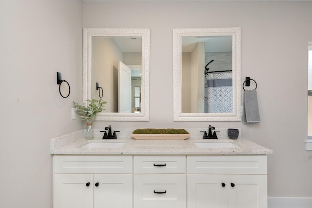 bathroom featuring vanity and a shower with curtain