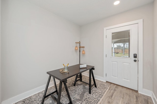 office space with light hardwood / wood-style floors