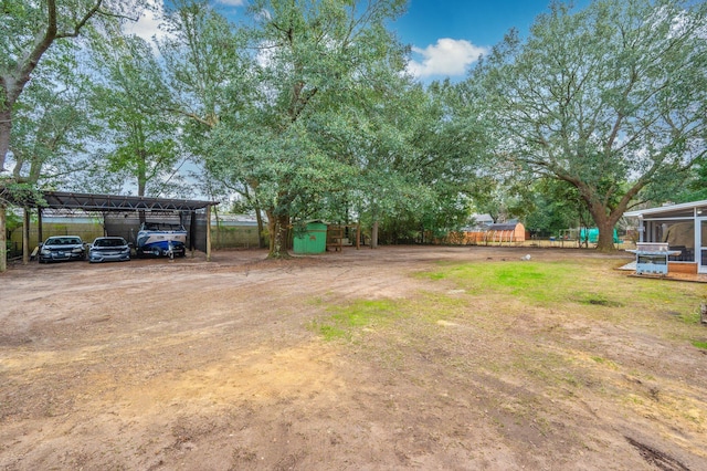 view of yard featuring a carport