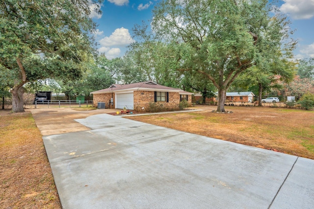 view of front of property with a garage and a front lawn