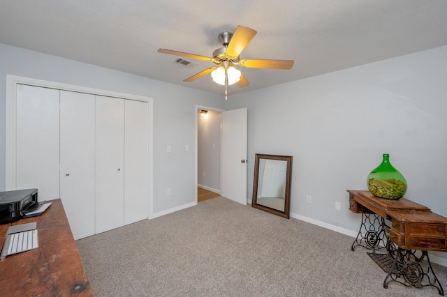 office with carpet and ceiling fan