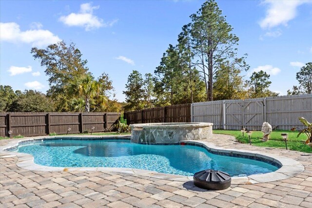 view of pool featuring a patio area and pool water feature