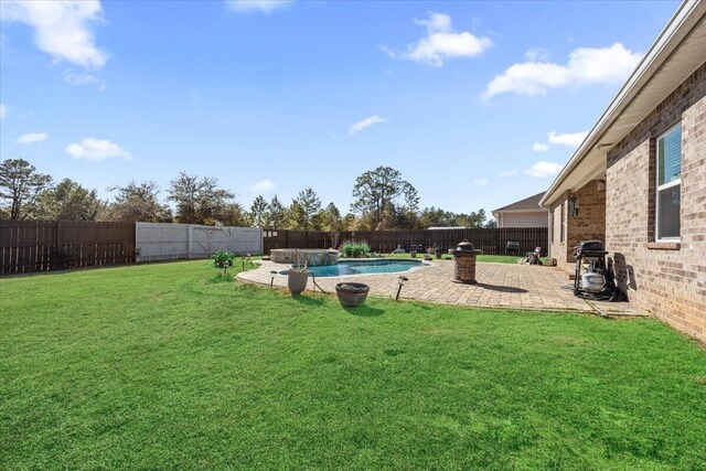 view of yard featuring a fenced in pool and a patio area