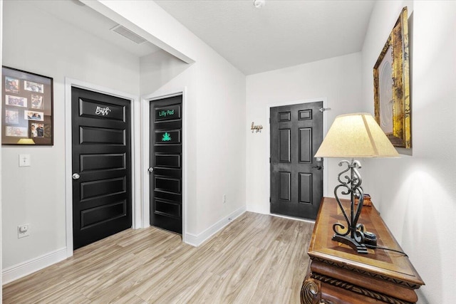 foyer with light hardwood / wood-style flooring