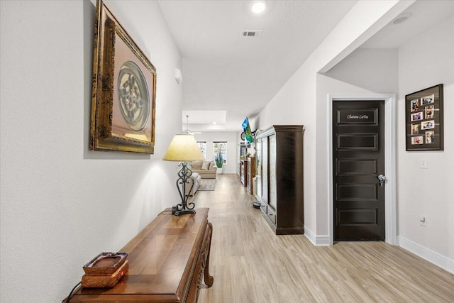 hall with light hardwood / wood-style flooring