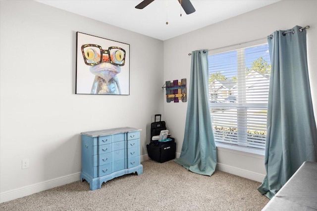 bedroom featuring light carpet and ceiling fan