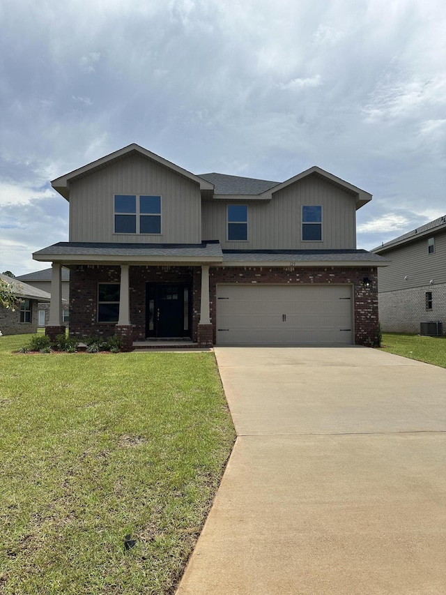 view of front of property with a garage, cooling unit, and a front lawn