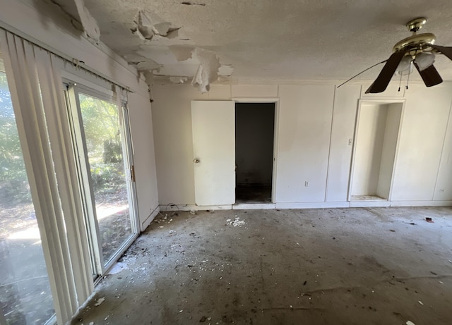 unfurnished room featuring a textured ceiling