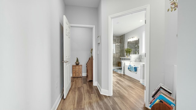 hallway featuring light wood-type flooring