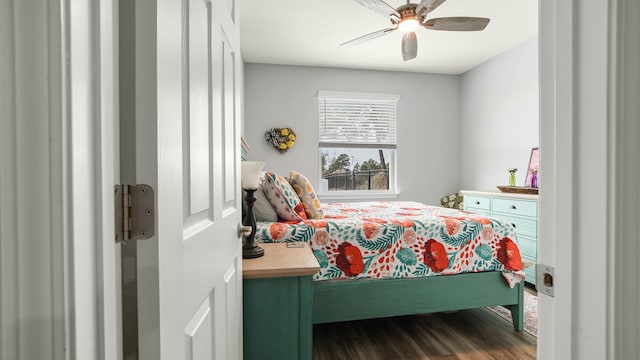 bedroom with hardwood / wood-style floors and ceiling fan