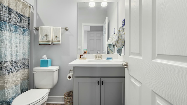 bathroom with toilet and vanity