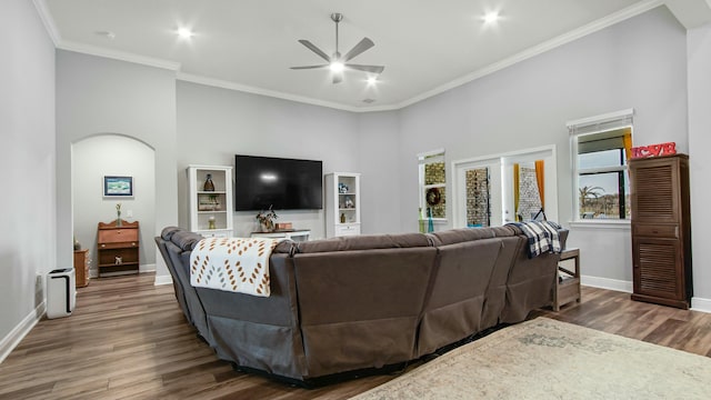 living room with french doors, crown molding, dark hardwood / wood-style floors, and ceiling fan