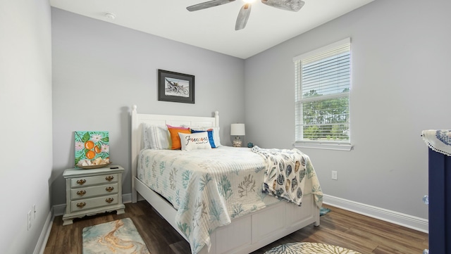 bedroom featuring dark hardwood / wood-style floors and ceiling fan