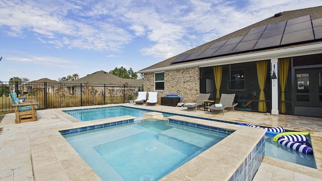 view of swimming pool with an in ground hot tub and a patio