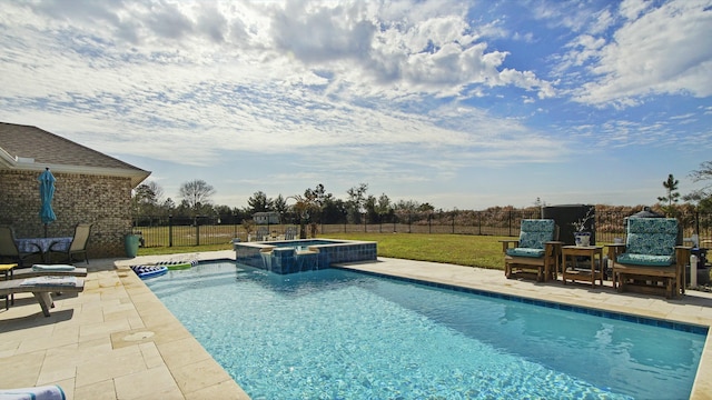 view of swimming pool with a patio area, a lawn, and an in ground hot tub