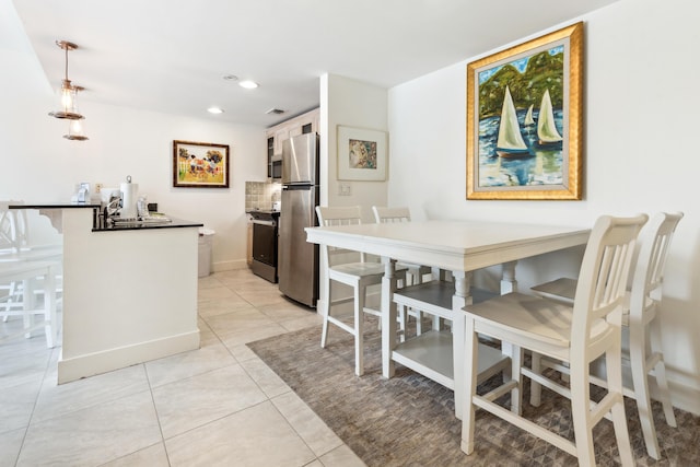 tiled dining space with sink