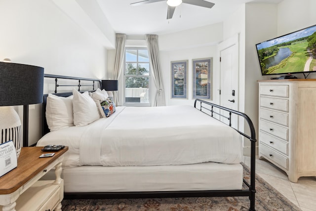 tiled bedroom with ceiling fan