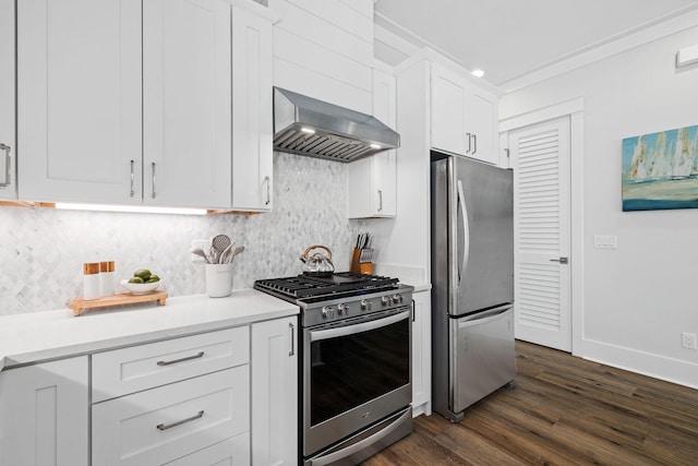 83 Sawgrass Ln, Santa Rosa Beach, FL 32459 - kitchen with white cabinetry, appliances with stainless steel finishes, decorative backsplash, and wall chimney exhaust hood