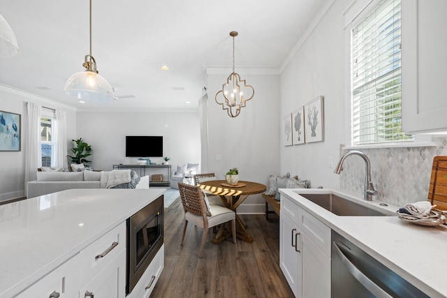 83 Sawgrass Ln, Santa Rosa Beach, FL 32459 - kitchen featuring white cabinetry, appliances with stainless steel finishes, sink, and hanging light fixtures