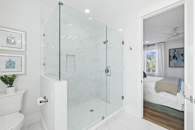 83 Sawgrass Ln, Santa Rosa Beach, FL 32459 - bathroom featuring ceiling fan, toilet, and an enclosed shower