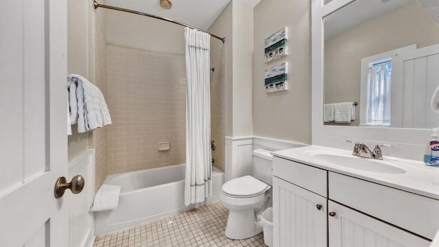 full bathroom featuring vanity, toilet, tile patterned floors, and shower / bath combo with shower curtain