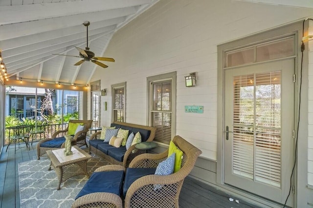 sunroom with vaulted ceiling with beams and ceiling fan