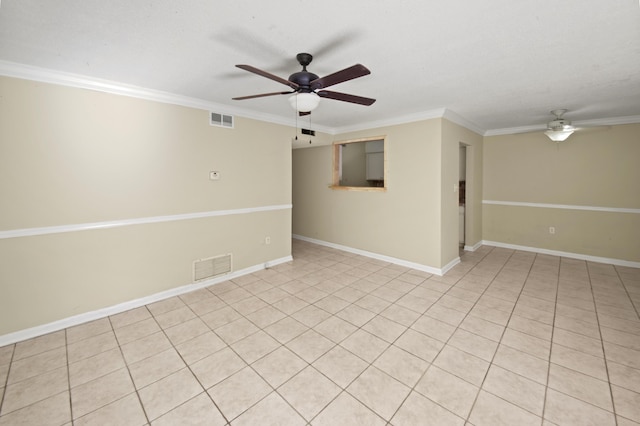 spare room featuring a ceiling fan, visible vents, and crown molding