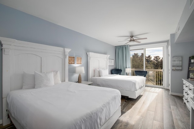 bedroom featuring access to exterior, hardwood / wood-style floors, and ceiling fan