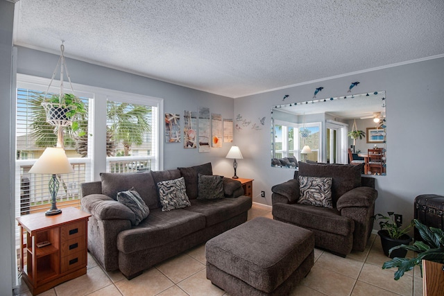 living room with light tile patterned flooring, ornamental molding, and a textured ceiling