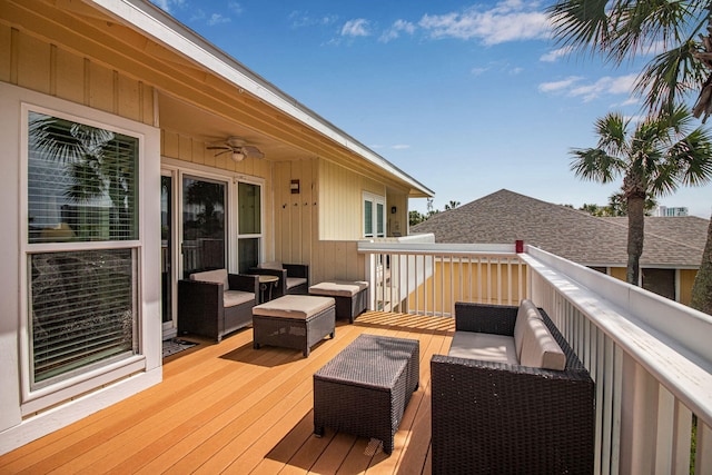 wooden deck featuring an outdoor hangout area and ceiling fan