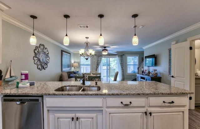 kitchen with light stone counters, stainless steel dishwasher, sink, and white cabinets