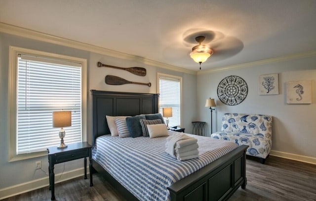 bedroom featuring crown molding, ceiling fan, and dark hardwood / wood-style flooring