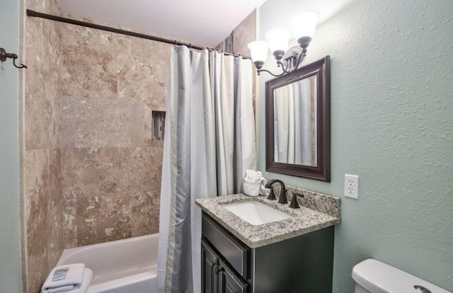 full bathroom with vanity, shower / bath combo, a chandelier, and toilet