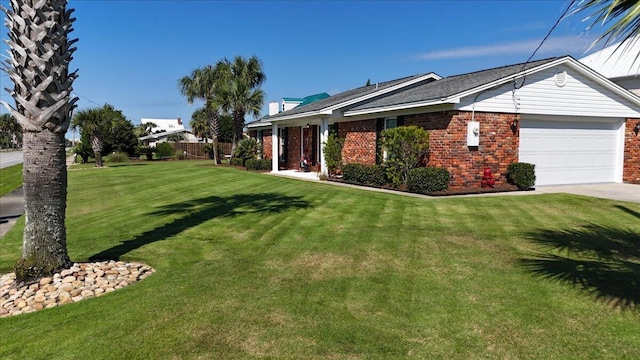 view of front of house with a garage and a front lawn