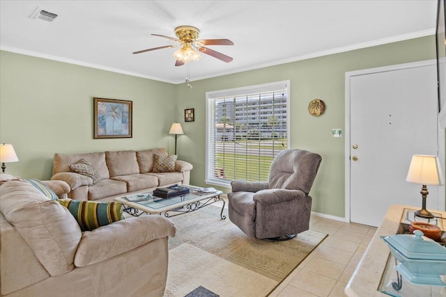 tiled living room with ornamental molding and ceiling fan