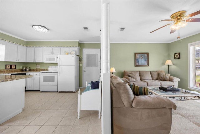 tiled living room with ceiling fan and ornamental molding