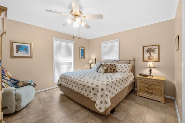 tiled bedroom with ornamental molding and ceiling fan